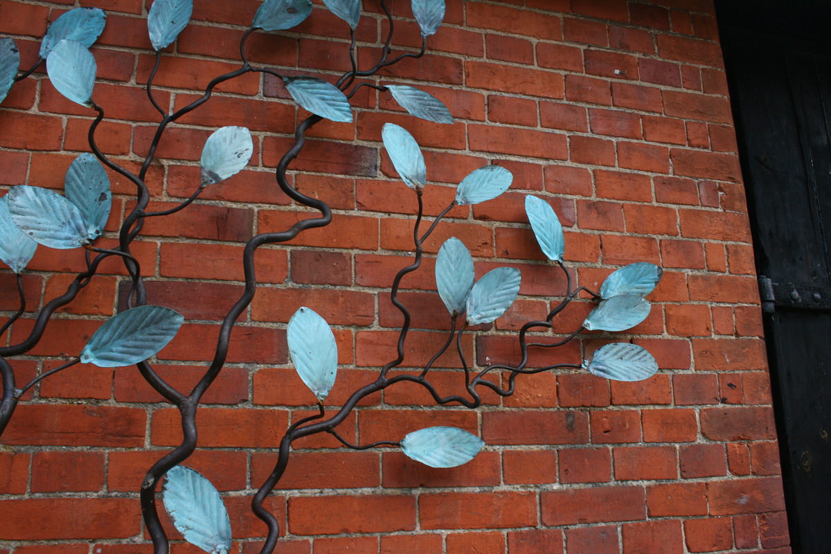 Espalier Tree Wall Sculpture wall climbing with verdigris leaves detail for specifers & architects by Mark Reed